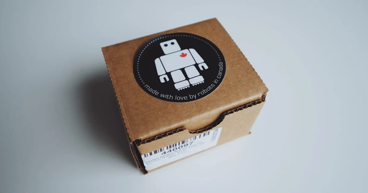 Ecommerce packaging materials including polymailers, bubble wrap, and corrugated boxes on a Malaysian seller workstation