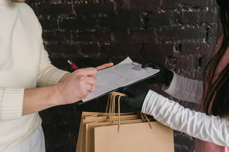 Seller photographing return parcel condition before opening as evidence documentation for Shopee return dispute in Malaysia